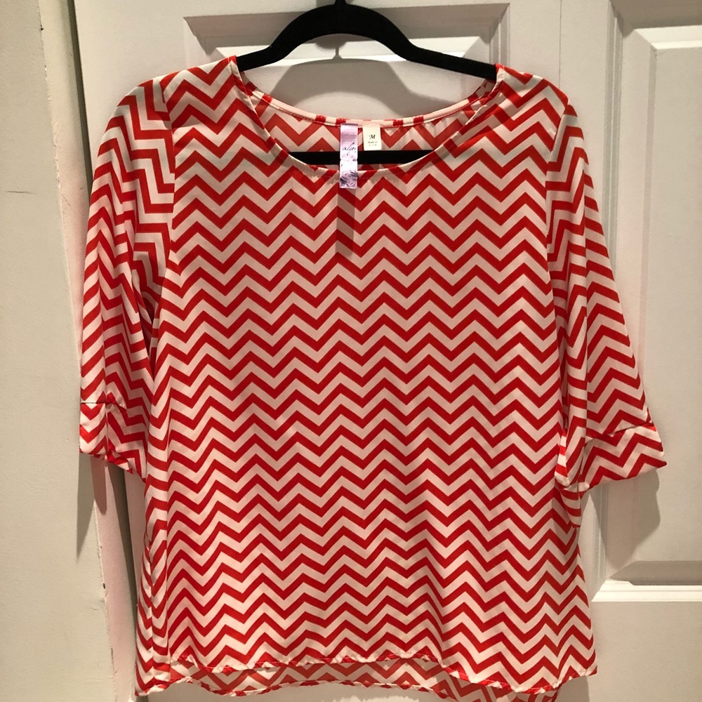 Francesca’s Orange Chevron Blouse